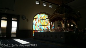 The stained glass window depicting the Khanda, our symbol of the Sikh faith